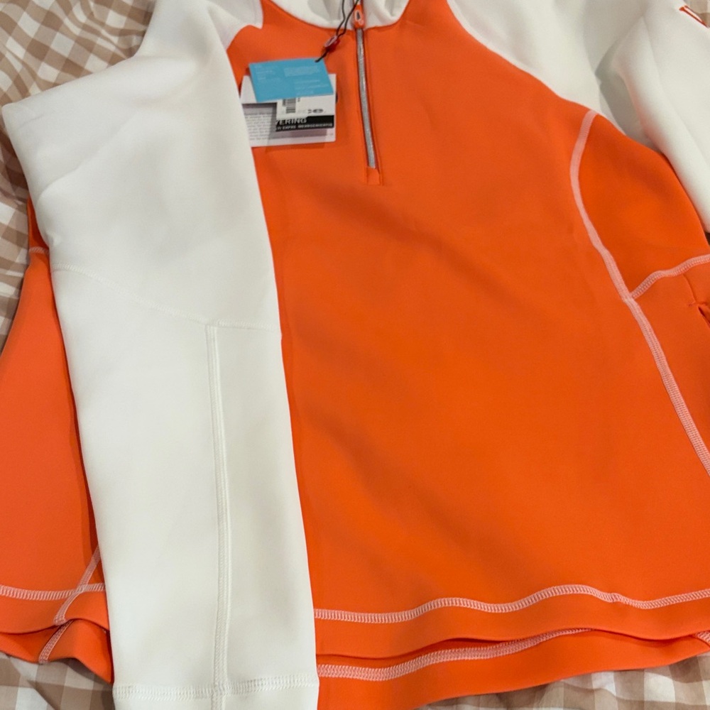 Sunice Vibrant Orange and White Pullover women’s golf